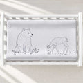 A personalized baby changing pad cover featuring a gray and white illustration of a polar bear and a deer.