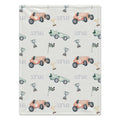 Personalized Race Car Baby Blanket. Vintage-style race cars in coral and mint, trophies, and checkered flags surround a custom name.