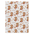Personalized Monkey and Rainbow Baby Blanket. Cheeky monkeys, warm-colored rainbows, hearts, and leafy sprigs surround a custom name on a white background.