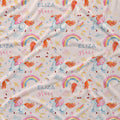 A close-up of a fabric surface with a repeating whimsical print featuring unicorns, rainbows, stars, hearts, and the text 'ELIZA grace' in blue and pink script.