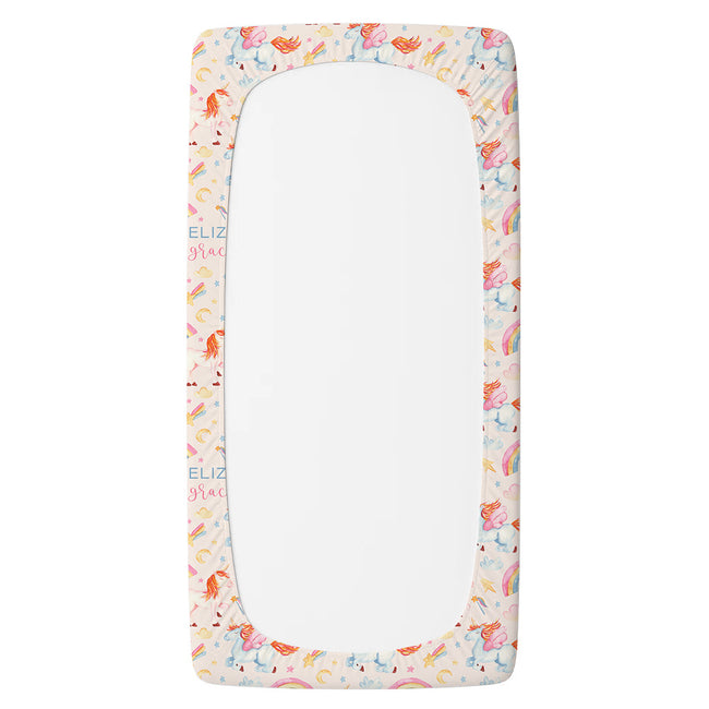 A personalized fitted sheet with a rounded top and bottom, featuring a pastel unicorn patterned border on a white background.