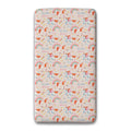 A custom sheet set with rounded corners, featuring a repeating pattern of orange unicorns, pastel pink and blue rainbows, and the text 'ELIZA Grace' on a light cream background.