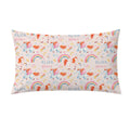 A rectangular decorative pillow featuring a whimsical repeating pattern of unicorns, rainbows, stars, and hearts on a pale pink background, with the text 'ELIZA grace' printed in blue and pink.