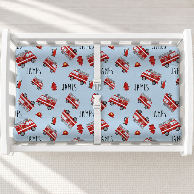 Red Fire Trucks Personalized Changing Pad Cover, featuring bright fire trucks and baby’s name for a fun, adventurous nursery touch.