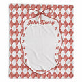 A personalized baby milestone chart print featuring a red and white harlequin diamond pattern border, a central white oval space with a red bow illustration, and the name 'John Henry' at the top. The chart includes numbered slots from 1 to 12 for months and is shown flat against a white background.