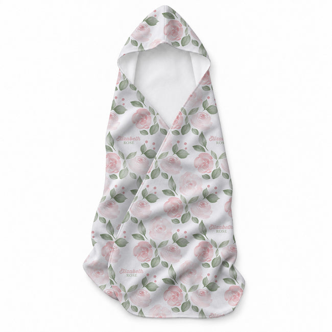 White hooded towel featuring blush pink roses, sage green leaves, pink berry accents, and the name Elizabeth Rose.