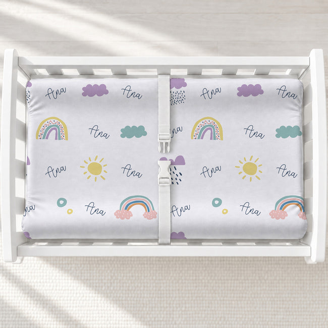 Scandinavian Rainbow Personalized Changing Pad Cover, featuring minimalist rainbows and baby’s name for a warm, modern nursery touch.