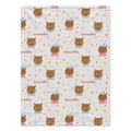 A personalized baby blanket featuring a repeating pattern of cartoon owl faces and the name 'Samantha' in pink script on a cream background.