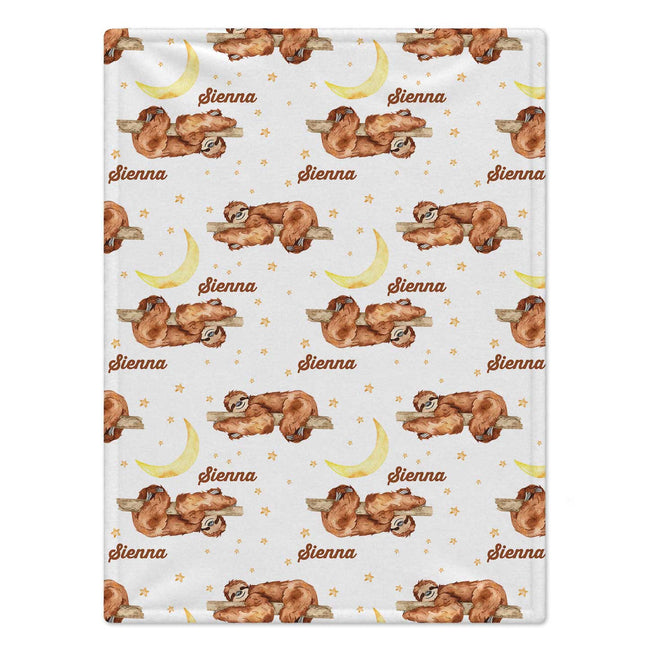 Personalized Sloth Baby Blanket. Cozy sloths resting on branches, golden moons, and little stars surround a custom name on a white background.