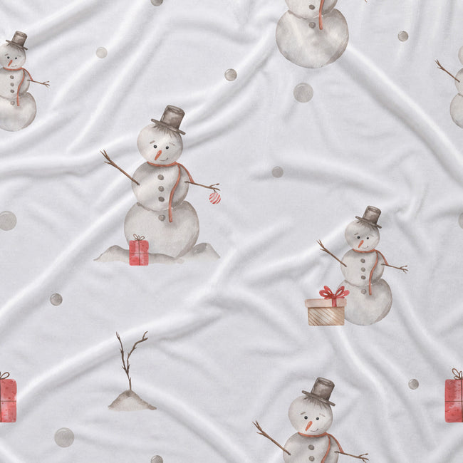 White fabric with a repeating pattern of watercolor snowmen in gray and brown, each wearing a red scarf and holding a red gift box, with small gray dots and a few bare tree branches scattered throughout.