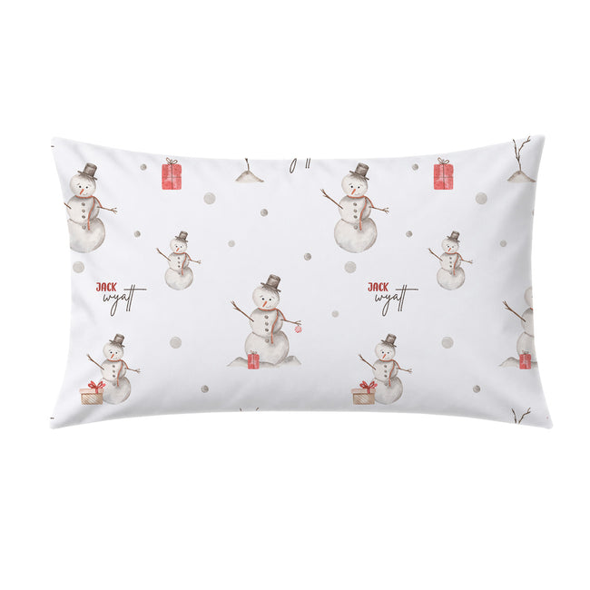 A rectangular white pillow sham featuring a festive Christmas pattern with watercolor snowmen, small red gift boxes, and the text 'jack wyatt' in black script.