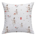 A square white throw pillow featuring a repeating pattern of watercolor snowmen in gray and brown, small red gift boxes, and the name 'Jack Wyatt' in a cursive font.