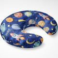 Angled view of the Space Explorers nursing pillow cover personalized with Scout, featuring watercolor planets and rockets on a navy starry background.