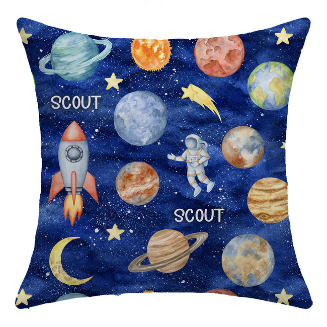 Space Explorers throw pillow personalized with Scout, featuring watercolor planets, a rocket, an astronaut, and golden stars on navy.