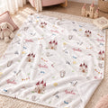 Personalized Castle Baby Girl Blanket. Whimsical castles and delicate fairytale details surround a custom name in a soft pink palette.
