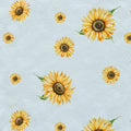 A repeating pattern of watercolor sunflowers with yellow petals, dark brown centers, and green leaves on a light blue textured background.