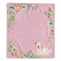 A baby milestone blanket featuring a watercolor-style floral border with green leaves and pastel flowers around the edges, plus a white swan wearing a small gold crown near the bottom right. Pink numbers 1 through 12 are printed vertically along the left and right sides.