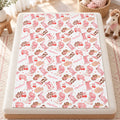 Personalized Cowgirl Boots Baby Girl Blanket. Pink cowgirl boots, western hats, bows, cherries, and hearts surround a custom name on a white background.