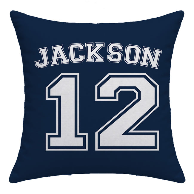 A square navy blue throw pillow featuring the name 'JACKSON' and number '12' printed in a white varsity-style font with navy outlines, shown against a plain white background.