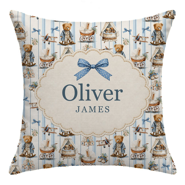 Personalized square throw pillow featuring a vintage teddy bear and airplane pattern on a light blue and white striped background, with a central cream-colored oval frame containing the names 'Oliver' and 'JAMES' under a blue bow.