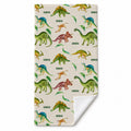 A personalized beach towel with a dinosaur pattern, featuring green, blue, and brown dinosaurs on a light beige background. The word 'CANDEN' is printed next to several dinosaurs.