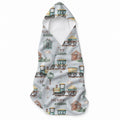 Pale blue hooded towel with watercolor-style trains, railway tracks, houses, trees, clouds, and the name Henry William.