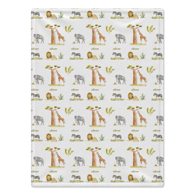 Full view of Wildwood Safari baby blanket with watercolor safari animals, trees, greenery, and the name Oliver on white.