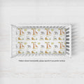 Wildwood Safari crib sheet personalized with Oliver in a white crib; caption notes horizontal pattern placement, with vertical available by request.