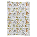 Full view of Wildwood Safari swaddle blanket with watercolor elephants, giraffes, lions, zebras, trees, and the name Oliver on white.