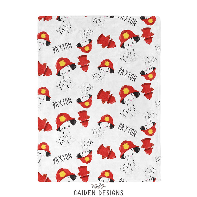 A personalized blanket with Dalmatian firehouse theme, including images of Dalmatians, fire hydrants, and fire engines.