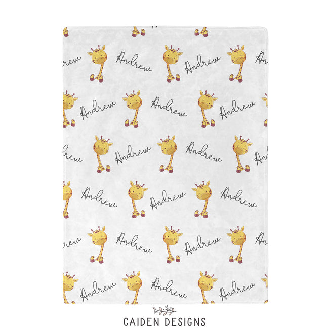 A personalized giraffe blanket with the name 'Andrew' printed alongside giraffe illustrations.