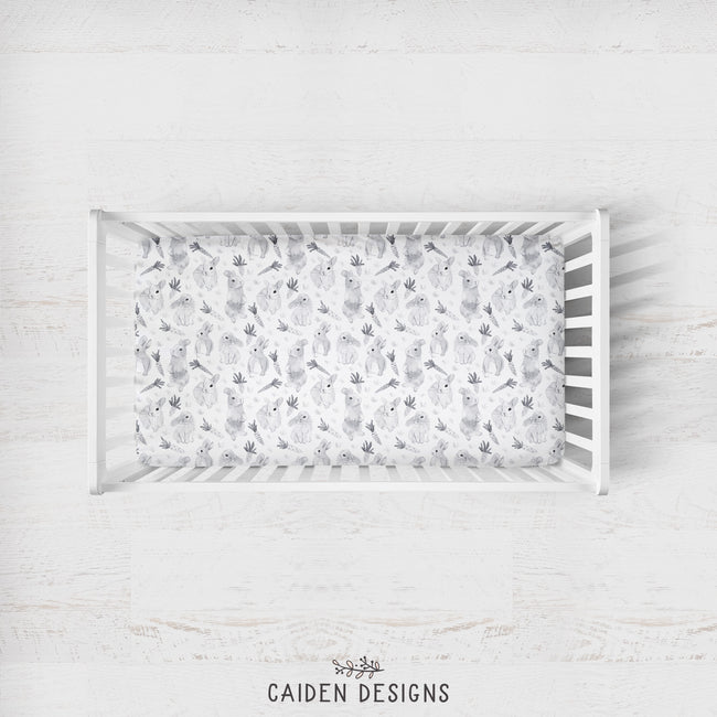 A gray and white watercolor bunny crib sheet