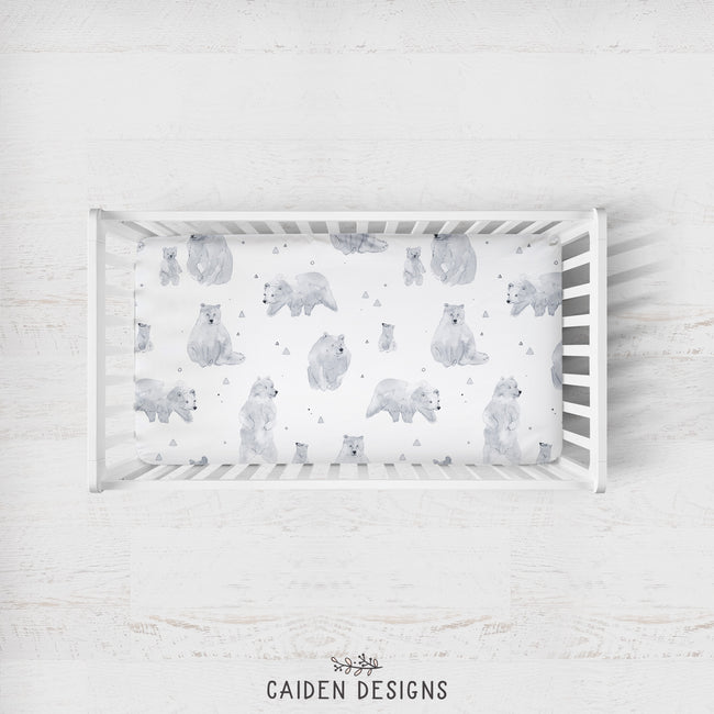 A crib sheet with a watercolor polar bear pattern