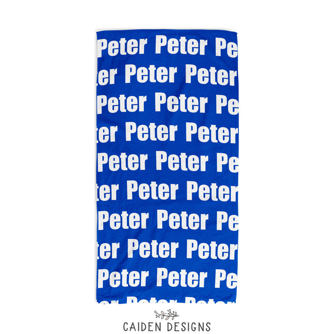 personalized beach towel in cobalt blue with the name Peter on it