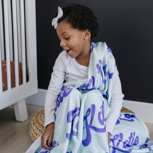 Girl with a soft mint personalized blanket for kids