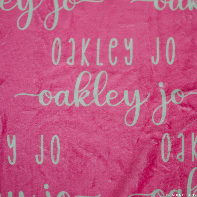 closeup of a personalized name blanket with the name Oakley Jo