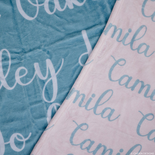 Closeup of two personalized baby blankets with names on them