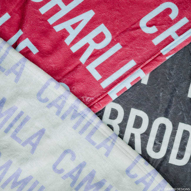 Three personalized name blankets