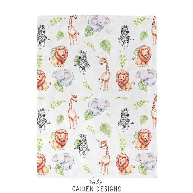 A personalized white blanket featuring repeated watercolor giraffe, elephant, lion, zebra and plants. 